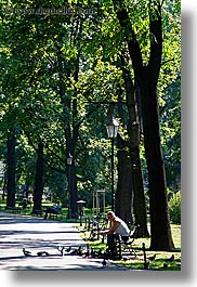 images/Europe/Poland/Krakow/People/Men/man-alone-with-birds-in-park.jpg