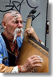images/Europe/Poland/Krakow/People/Men/man-playing-odd-harp-1.jpg