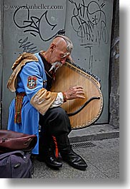 images/Europe/Poland/Krakow/People/Men/man-playing-odd-harp-3.jpg