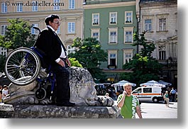 images/Europe/Poland/Krakow/Performance/man-wheel_chair-on-stone-lion.jpg