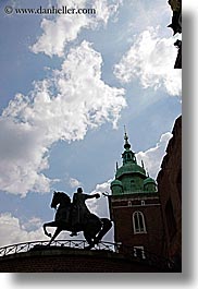 arts, bell towers, buildings, clouds, europe, horses, krakow, poland, silhouettes, statues, steeples, structures, vertical, wawel castle, photograph
