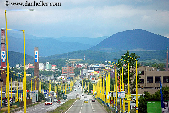 city-street-w-yellow-street-lights-n-mtn-1.jpg