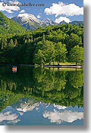 bohinj, canoes, europe, fishermen, lakes, mountains, reflections, slovenia, snowcaps, vertical, water, photograph