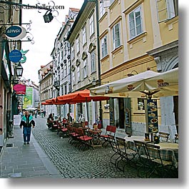 cafes, cities, europe, ljubljana, narrow, pedestrians, slovenia, square format, streets, towns, umbrellas, walk, photograph