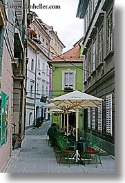 cafes, cities, europe, ljubljana, narrow, slovenia, streets, towns, umbrellas, vertical, photograph
