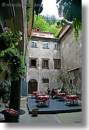 buildings, cafes, courtyard, europe, ljubljana, plants, slovenia, towns, vertical, photograph