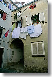 archways, clothes, europe, hangings, laundry, pirano, slovenia, vertical, windows, photograph