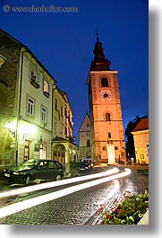 bell towers, buildings, cars, europe, long exposure, motion blur, nite, ptuj, slovenia, streaks, towns, vertical, photograph