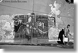 images/Europe/Slovenia/Ptuj/door-graffiti-n-man-walking-bw.jpg