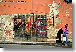 doors, europe, graffiti, horizontal, men, ptuj, slovenia, walking, photograph