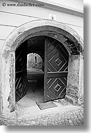 archways, black and white, cobblestones, doors, europe, ptuj, slovenia, vertical, photograph