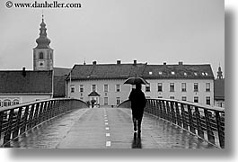 images/Europe/Slovenia/Ptuj/man-walking-bridge-in-rain-bw.jpg