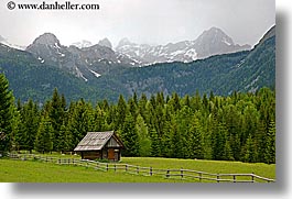 barn, europe, fences, fields, horizontal, mountains, slovenia, snowcaps, triglavski narodni park, photograph