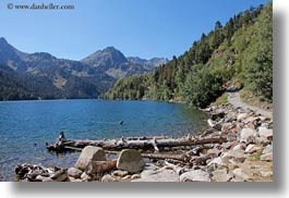 images/Europe/Spain/AiguestortesHike2/log-rocks-lake-n-mtns.jpg