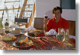 images/LatinAmerica/Ecuador/Galapagos/Boats/Sagitta/Food/man-w-wine7.jpg