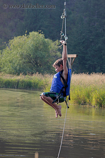 boy-swinging-over-lake.jpg