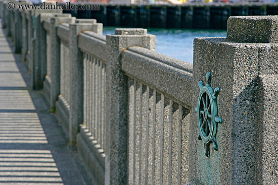 boat-wheel-n-concrete-fence.jpg