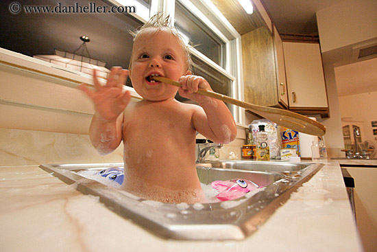 baby dolls swimming in the sink